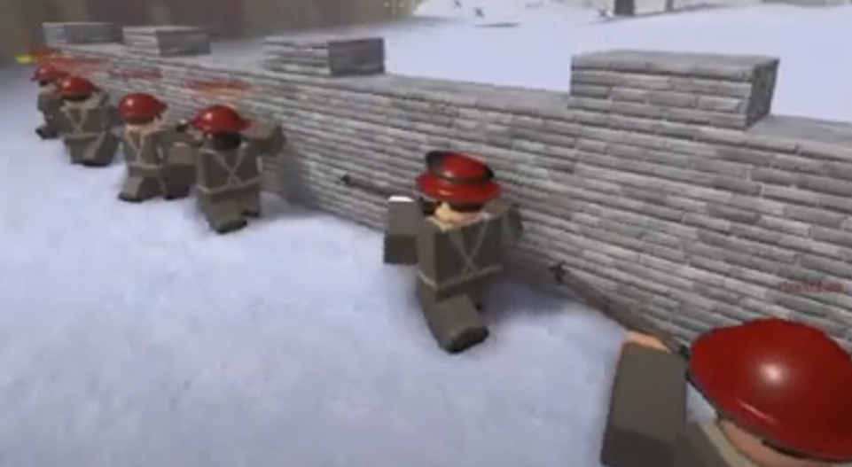 Korean soldiers taking cover underneath a wall as Canadian soldiers charge their position