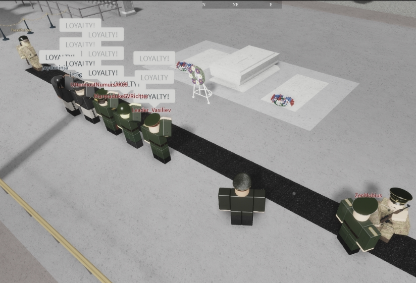 Turan soldiers saluting the coffin of what was alleged to be Aleczaender
